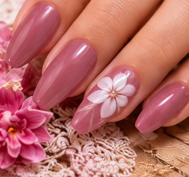 Mauve dip powder nails with a white flower